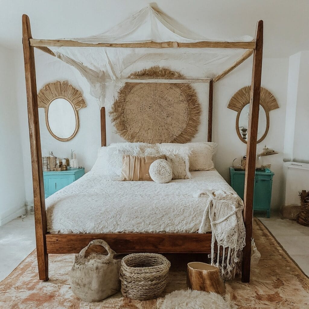 Coastal bedroom with white textured bedding and macrame hanging on wall