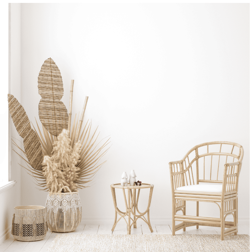 bamboo chair and side table against white wall.