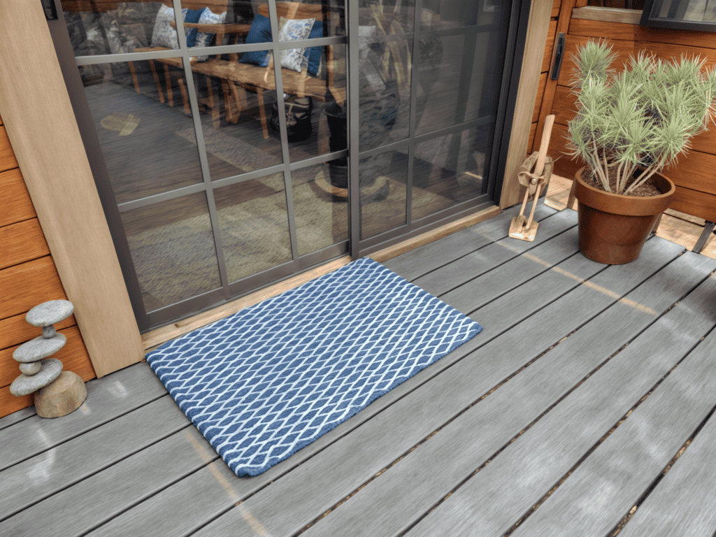 dark blue and with doormat on wooden deck